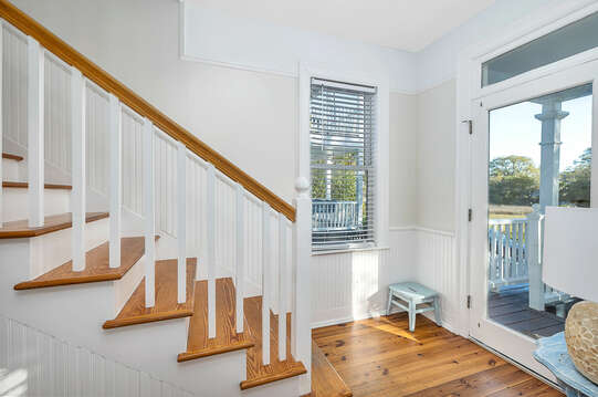Stairs leading from the foyer to additional living space.