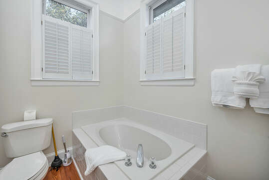 The Master Bathroom has a walk-in shower, a garden tub and high windows for natural light.