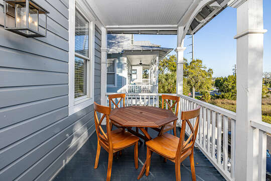 There are areas for dining and relaxing on the upper porch.