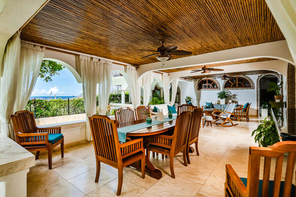 Unwind in style with an outdoor living room and mesmerizing ocean view.