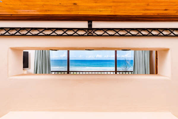 Fall asleep and wake up to an amazing ocean view in Bedroom #1.