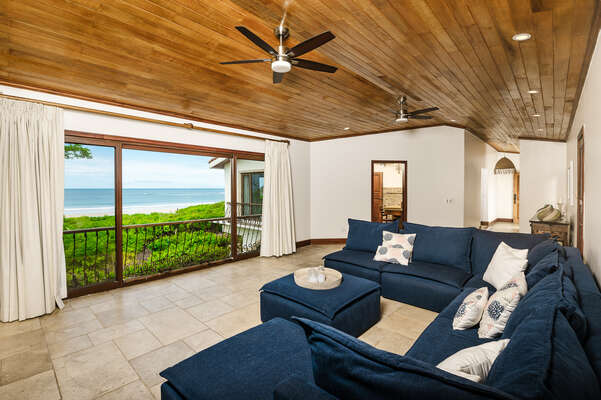 Seaside serenity in our ocean-view living room, where blue hues and relaxation meet.