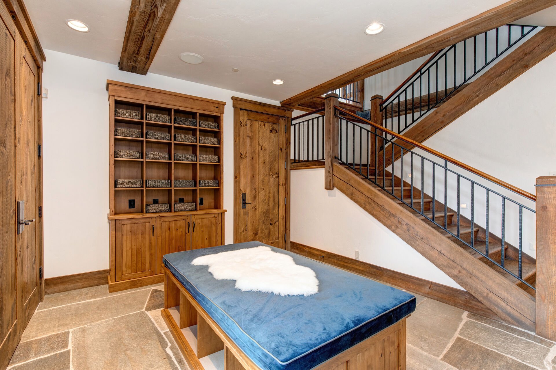 Ground level mudroom with bench and in closet storage