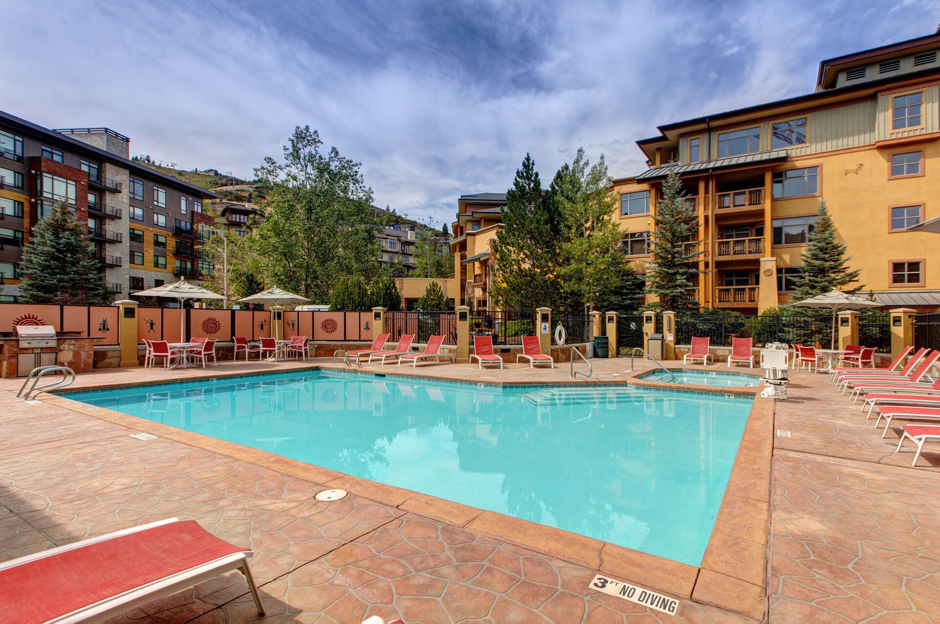 Community Amenities with outdoor firepit, hot tub, pool, fitness center, and grill area