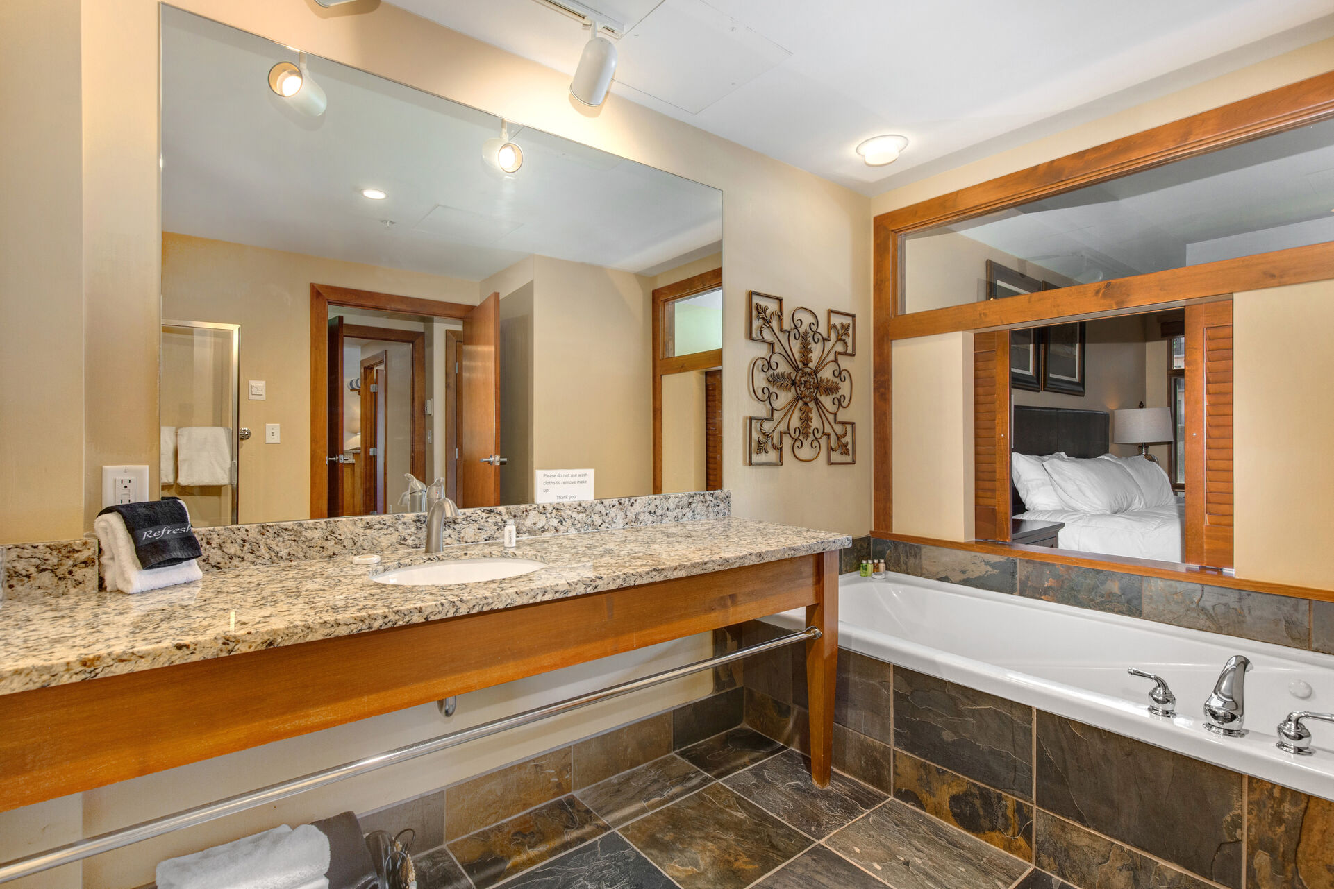Master Bathroom with oversized vanity, large tiled shower, and jetted tub