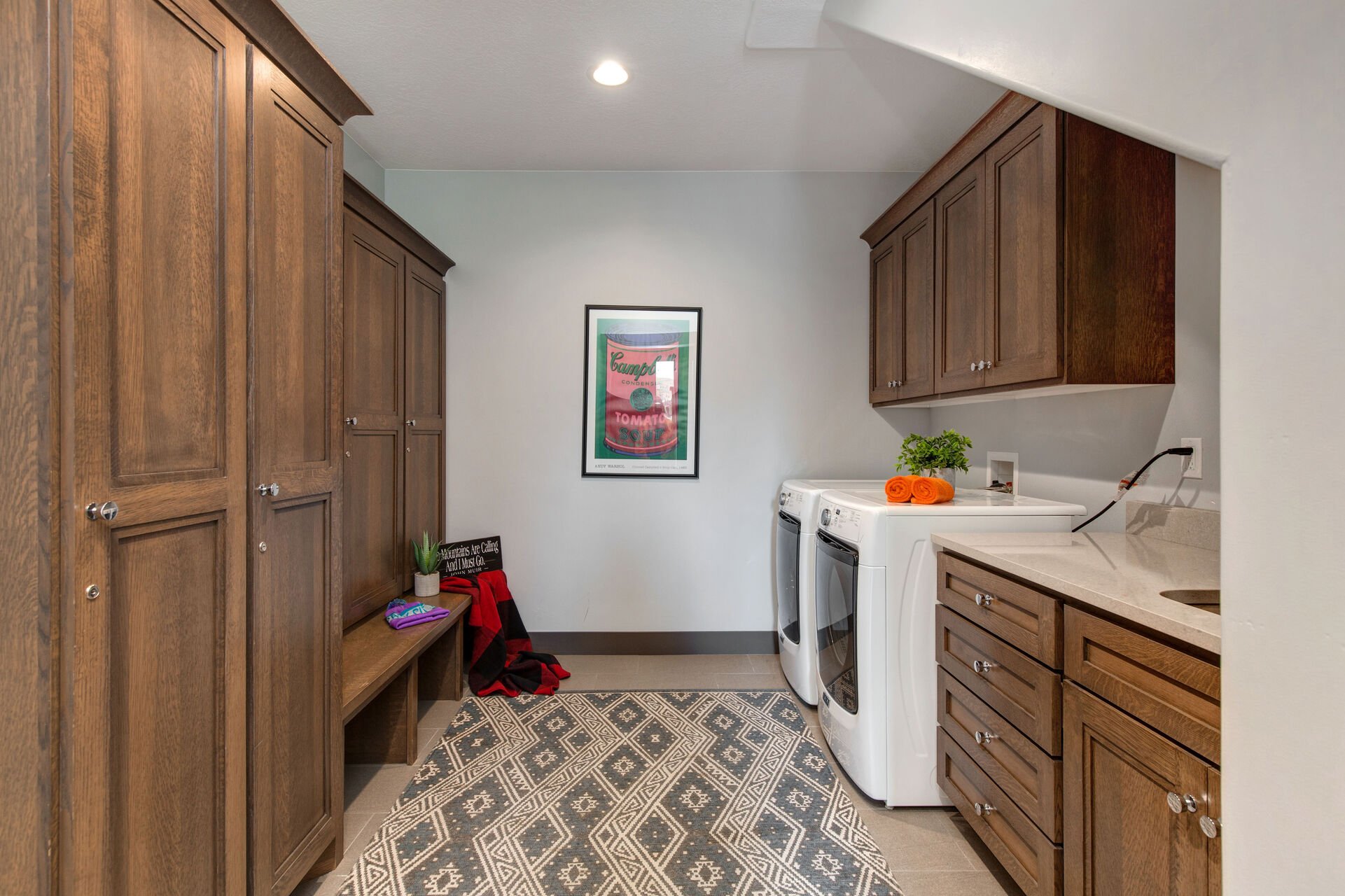 Front Entryway with spacious mudroom and full-sized washer and dryer units. This space has ample room for ski equipment and a convenient bench