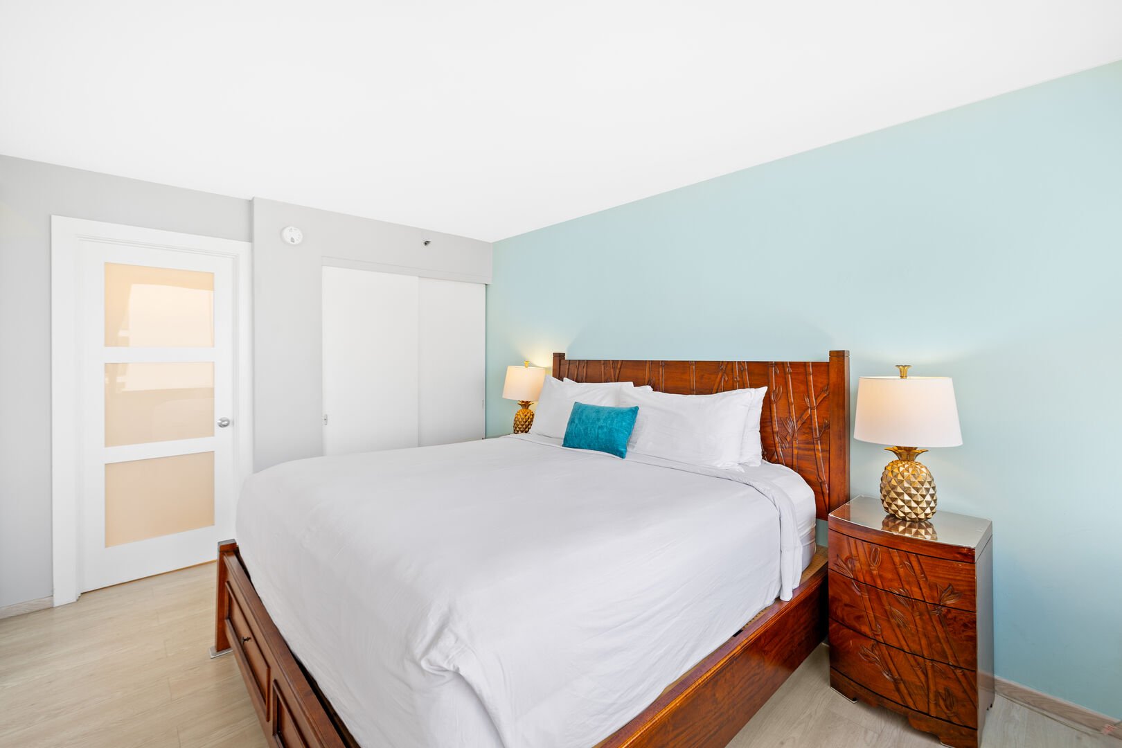 The bedroom features a king-size bed, 2 nightstands, and a closet!