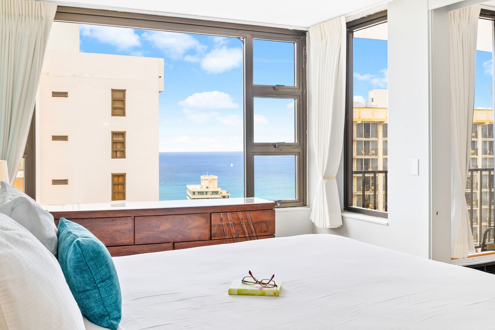 The bedroom features a king-size bed and a gorgeous view of the Ocean!