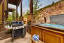 Private Hot Tub patio with seating and table for two, propane bbq, and 8-person spa