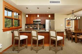 Kitchen with breakfast bar seating for 3