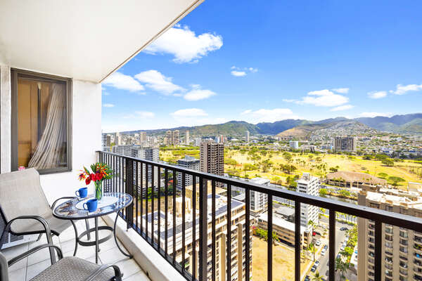 Spacious balcony with mountain view. Patio furniture for a relaxing time