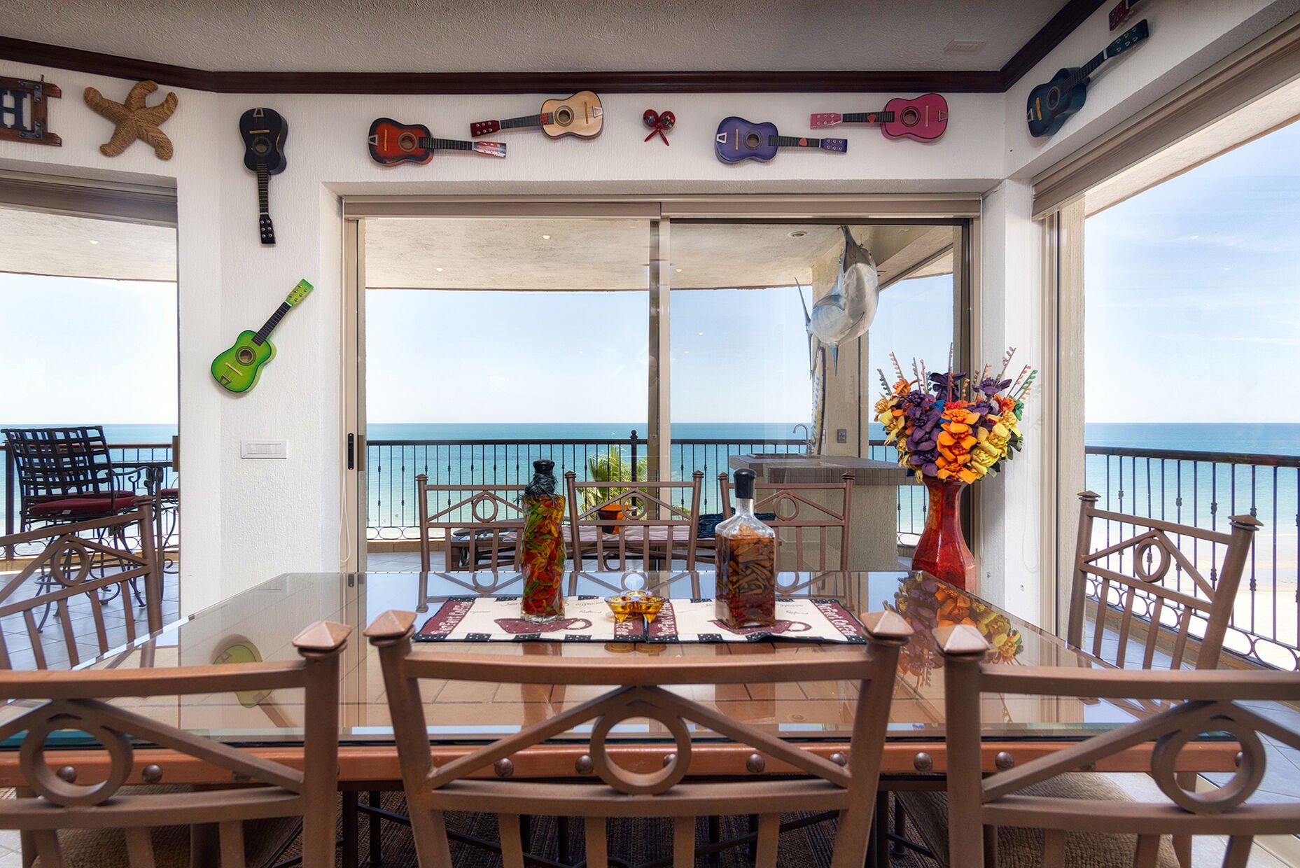 The dining table takes in expansive views, and is colorful and very 'Mexican'.