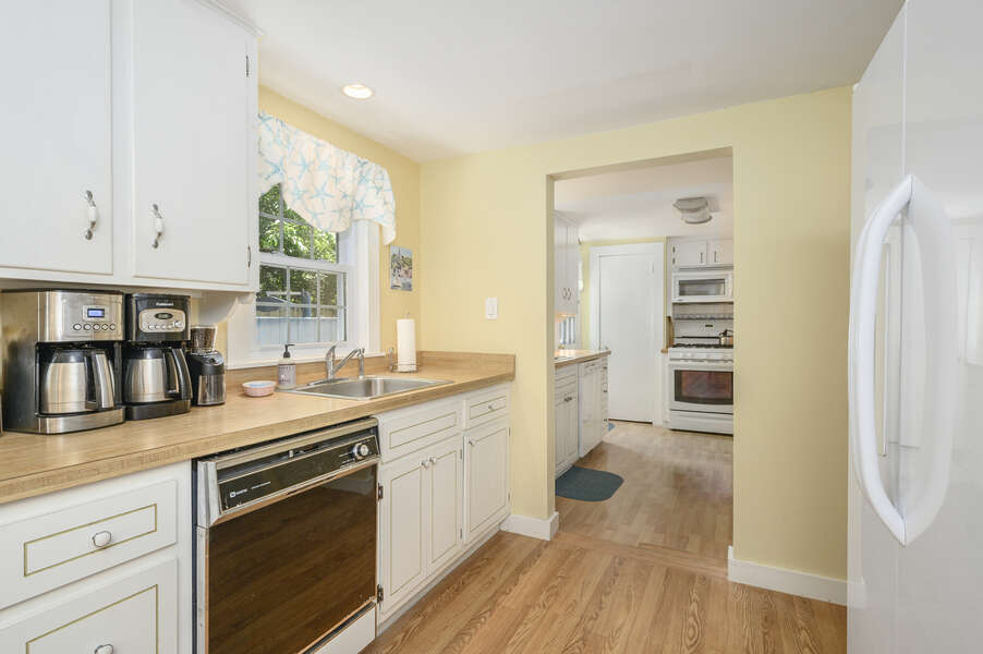 Galley kitchen with dishwasher, coffee pots,fridge-21 Pine Street- Harwichport- Cape Cod- New England Vacation Rentals