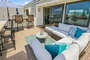 Outdoor sofa sectional for lounging in the sun listening to the ocean