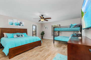 guest bedroom with king bed and bunk bed