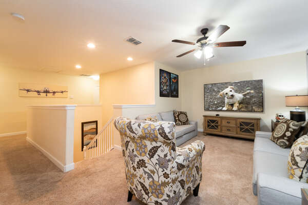 Upstairs TV room and landing with 75