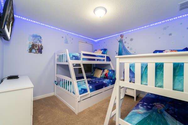 Bedroom 5 has two sets of single over full bunk beds with a Frozen theme