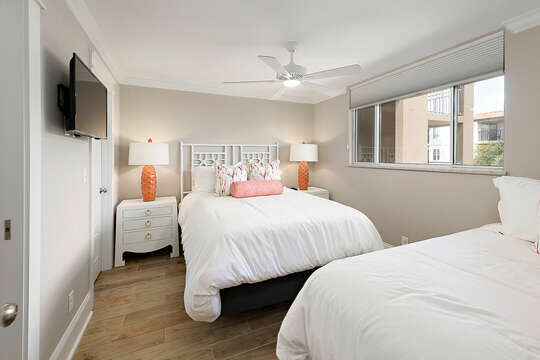 Guest bedroom with two beds--one queen and one twin