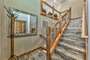 Grand Two Story entrance with wood accents . Natural Floor entrance to experience true Tahoe Luxury