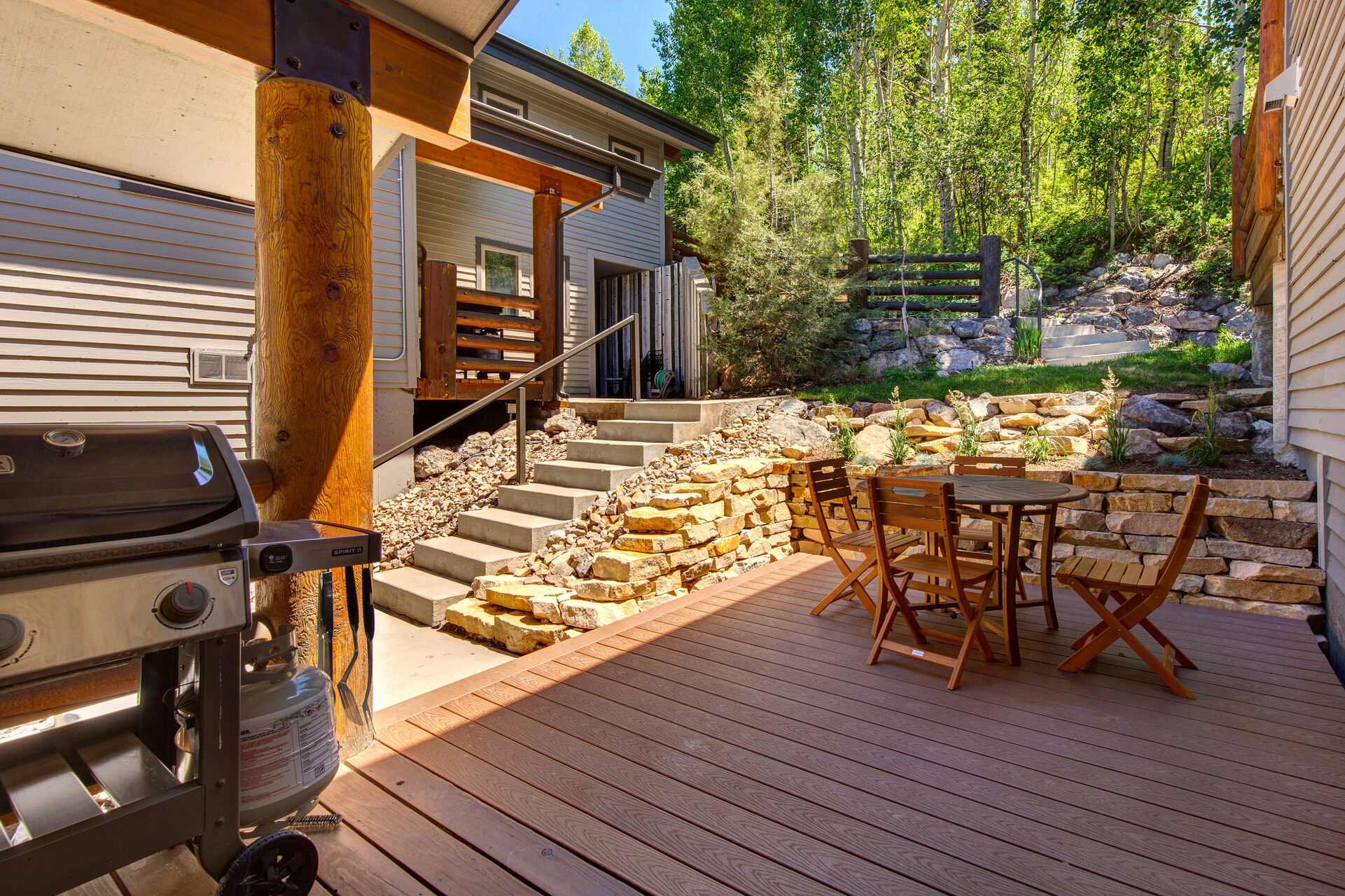 Main Level Patio off of kitchen with BBQ grill and table-seating for up to four