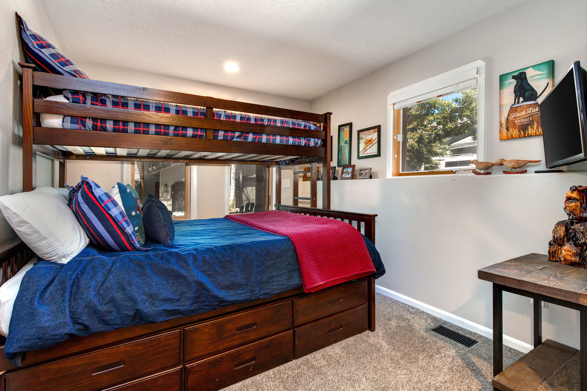 Lower Level Bunk Room with twin over queen bunk, smart tv, private patio access, and en suite bathroom