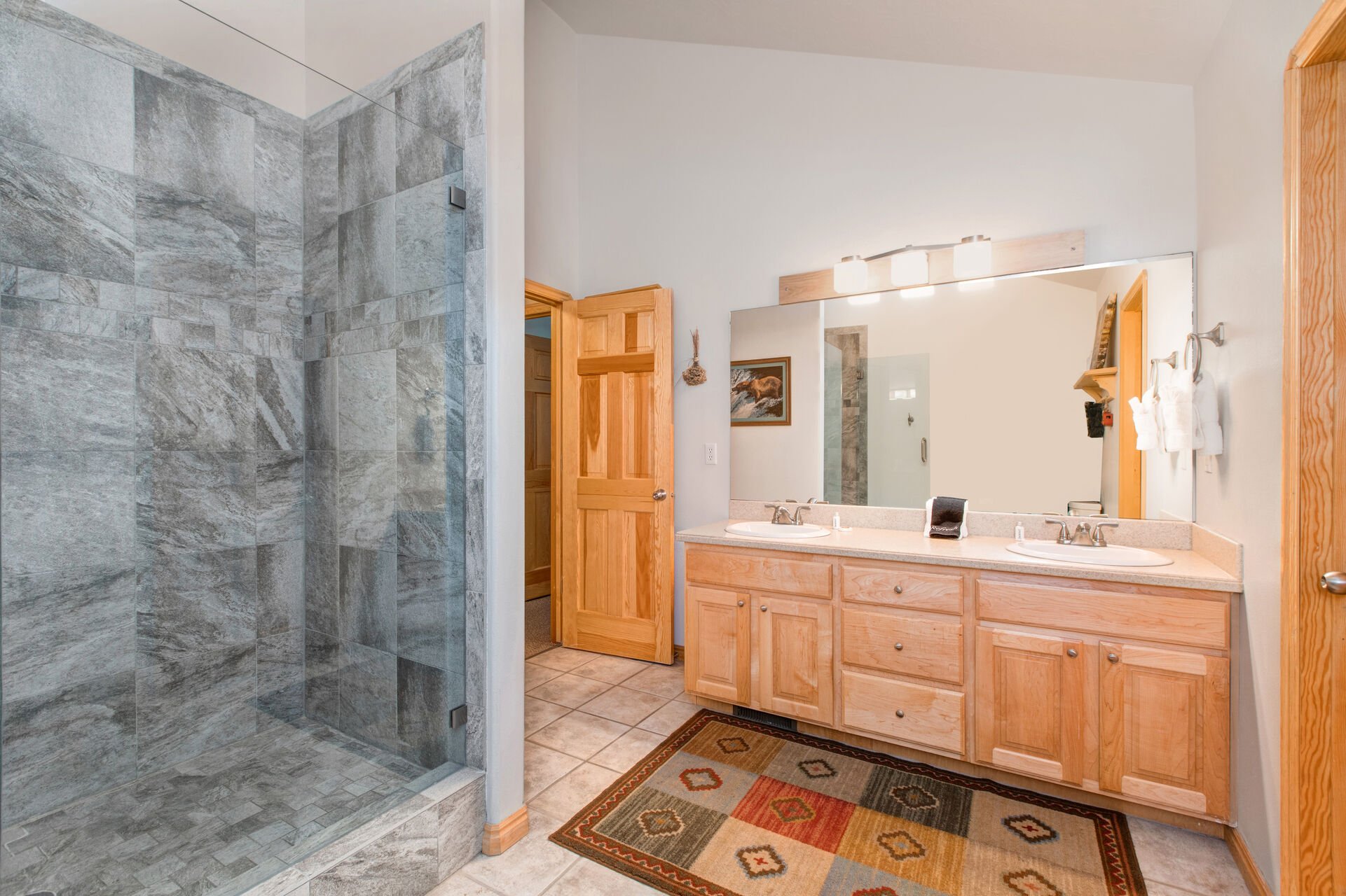 Master Bathroom with over-sized tile shower, and dual vanities