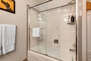 Bunk Room Bathroom with dual vanities and tub/shower combo