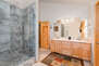 Master Bathroom with over-sized tile shower, and dual vanities