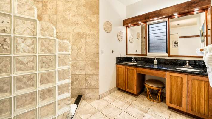 Primary bathroom with walk in shower, dual sinks