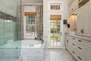 Master Bathroom with over-sized tile shower, jetted soaking tub, and access to the homes' back yard patio