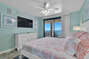 Primary Bedroom with King Size Bed, Flat Screen and Private Access to Balcony overlooking the Gulf of Mexico
