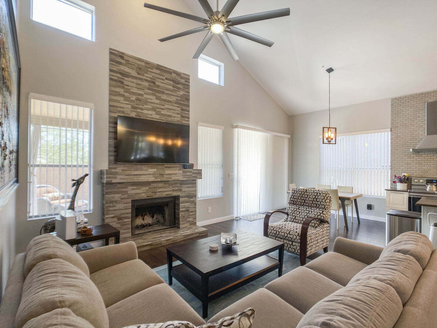 Calming fireplace enhances open concept living space.