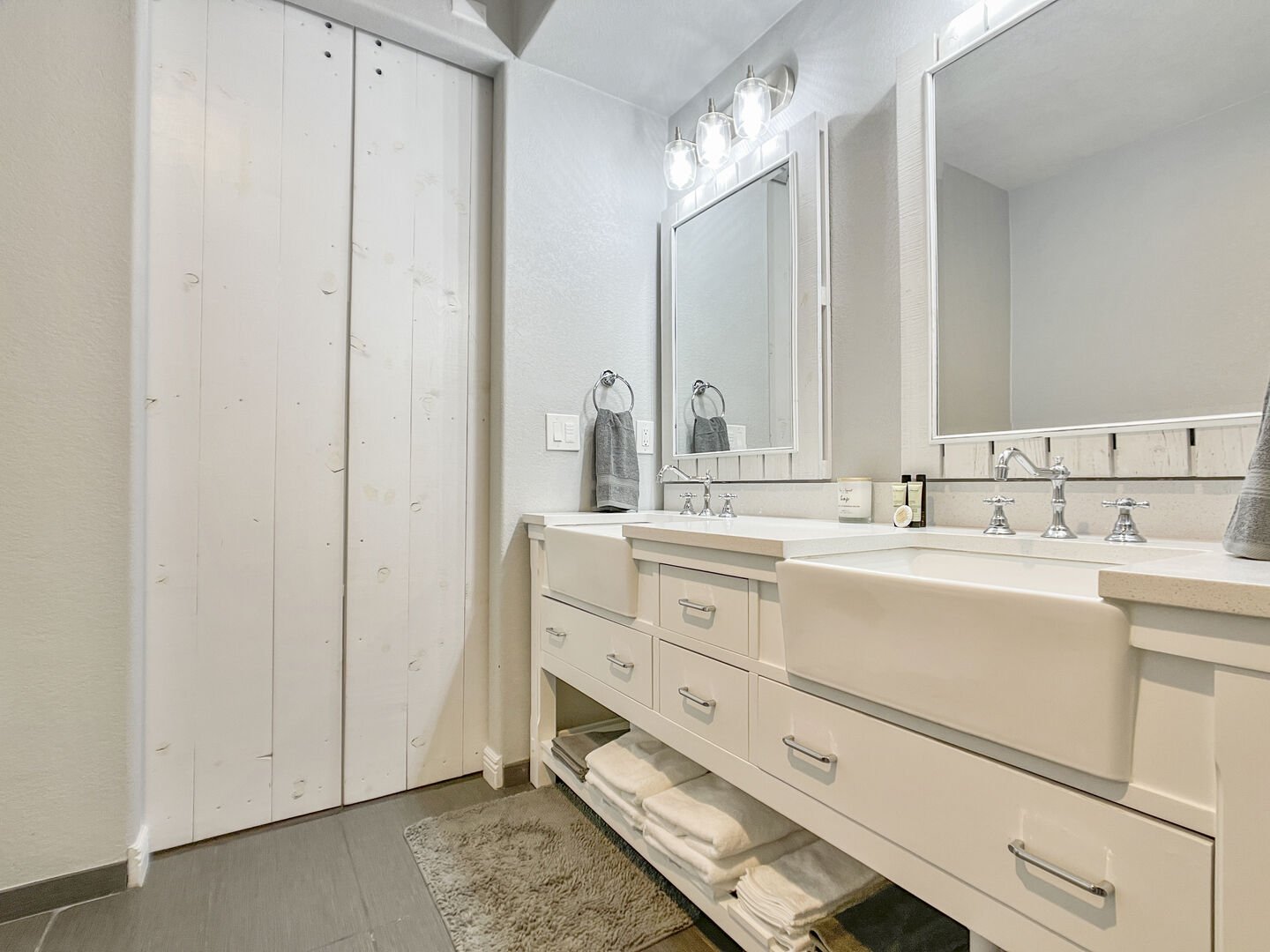 Double vanity with ample lighting in lux bathroom!