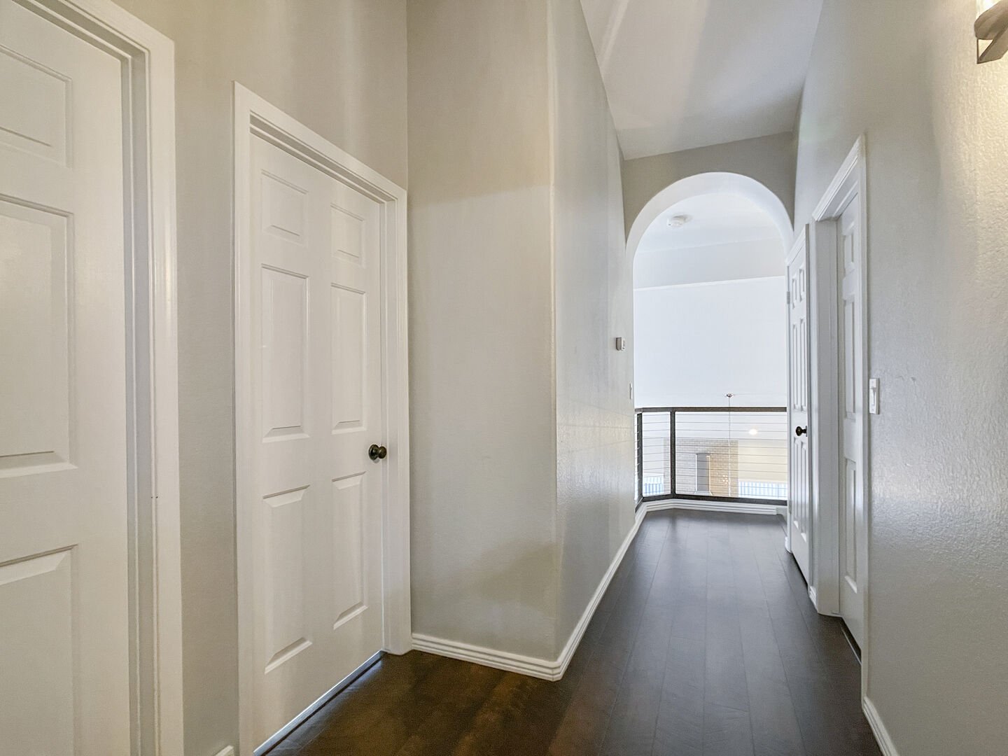 A bathroom, two bedrooms and the study loft are located off of this hallway!