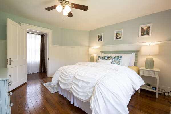 2nd Bedroom: Easy access to hallway with shared bathroom. Queen-sized bed with a closet and dresser.