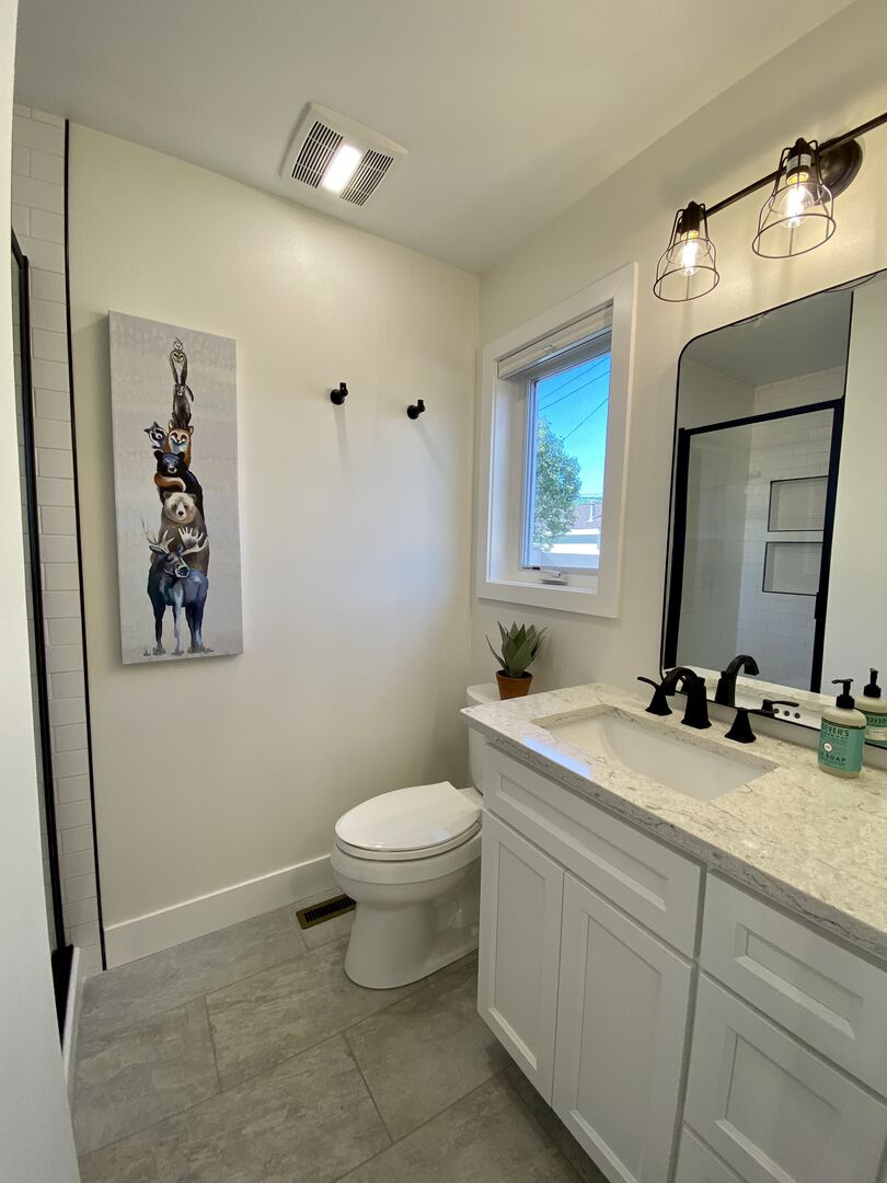en suite Bathroom featuring gorgeous tiled walk-in shower