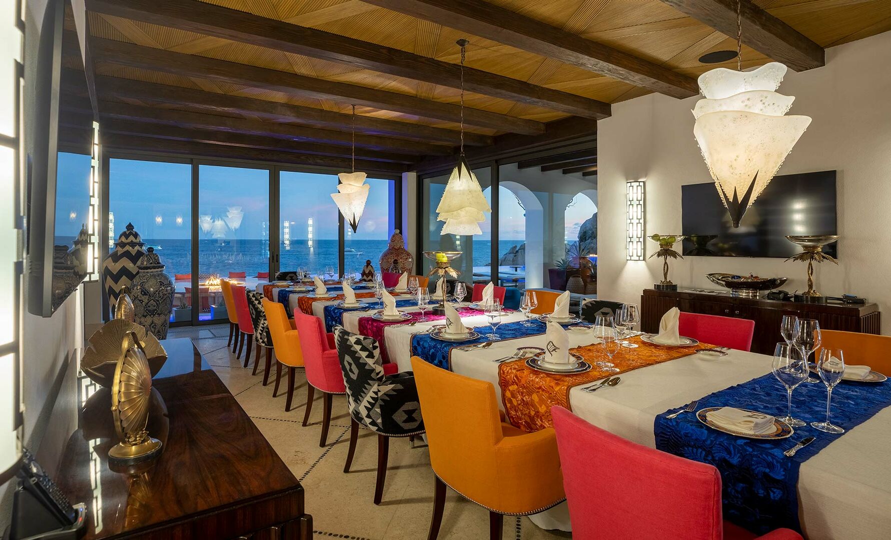 The dining area of this Los Cabos beachfront rental, with a long table and seating for over 20.