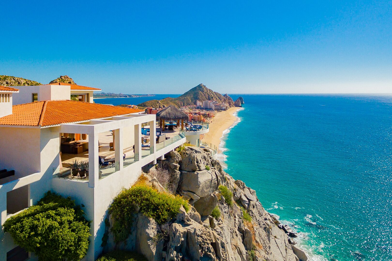 A zoomed out sideview of this oceanfront home in Los Cabos.