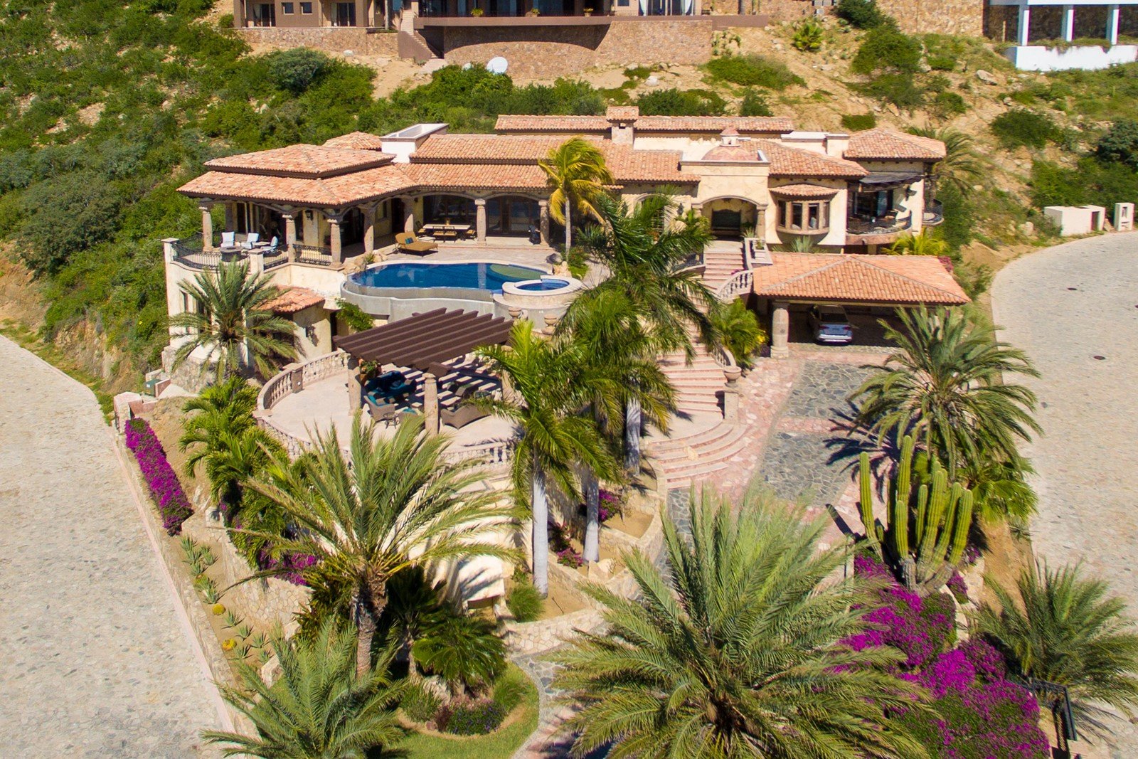 Elevated view of the pool and six-bedroom home in Los Cabos.