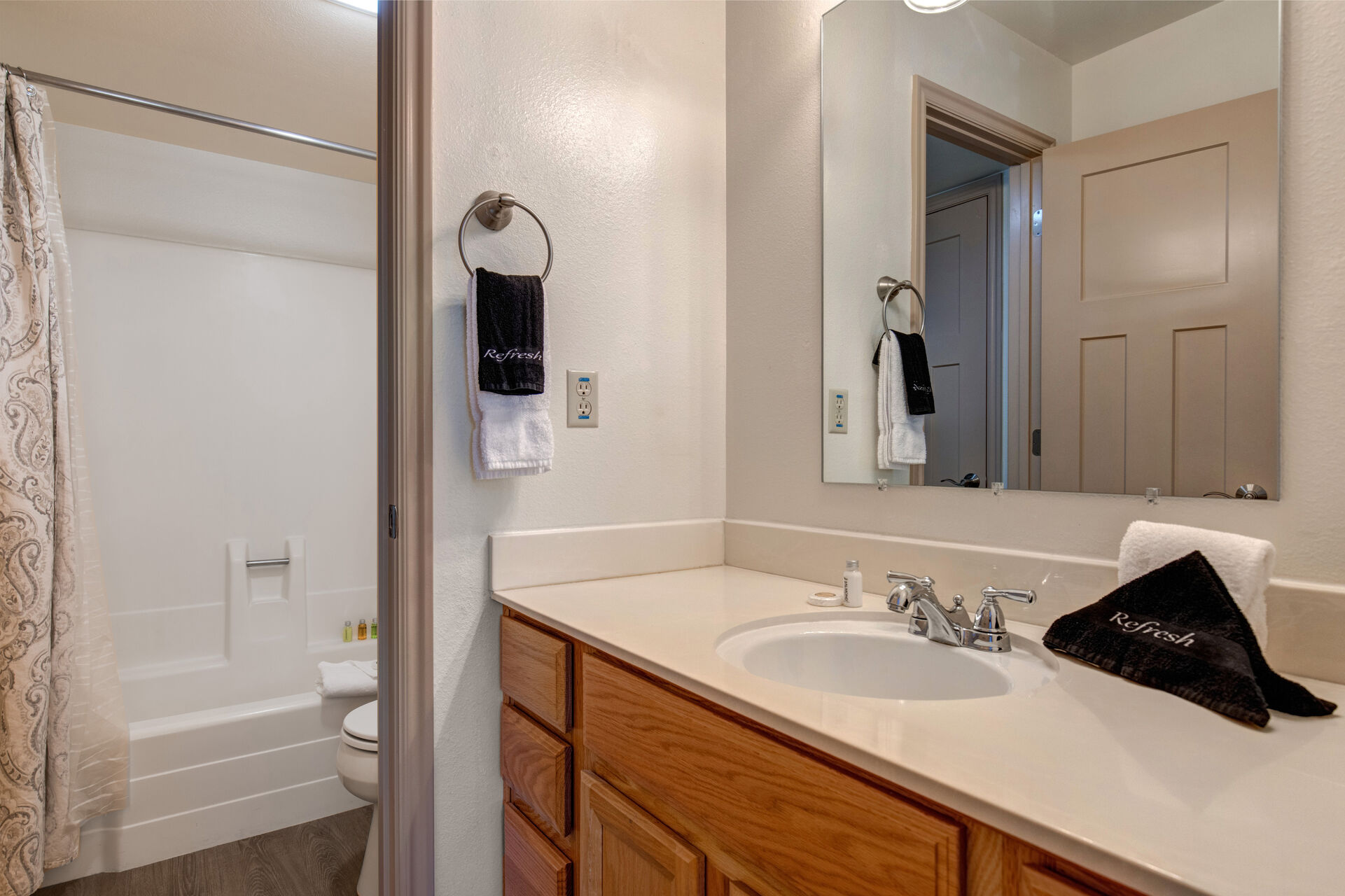 Master Bathroom with jack-n-jill access, two separate vanities, and tub/shower combo