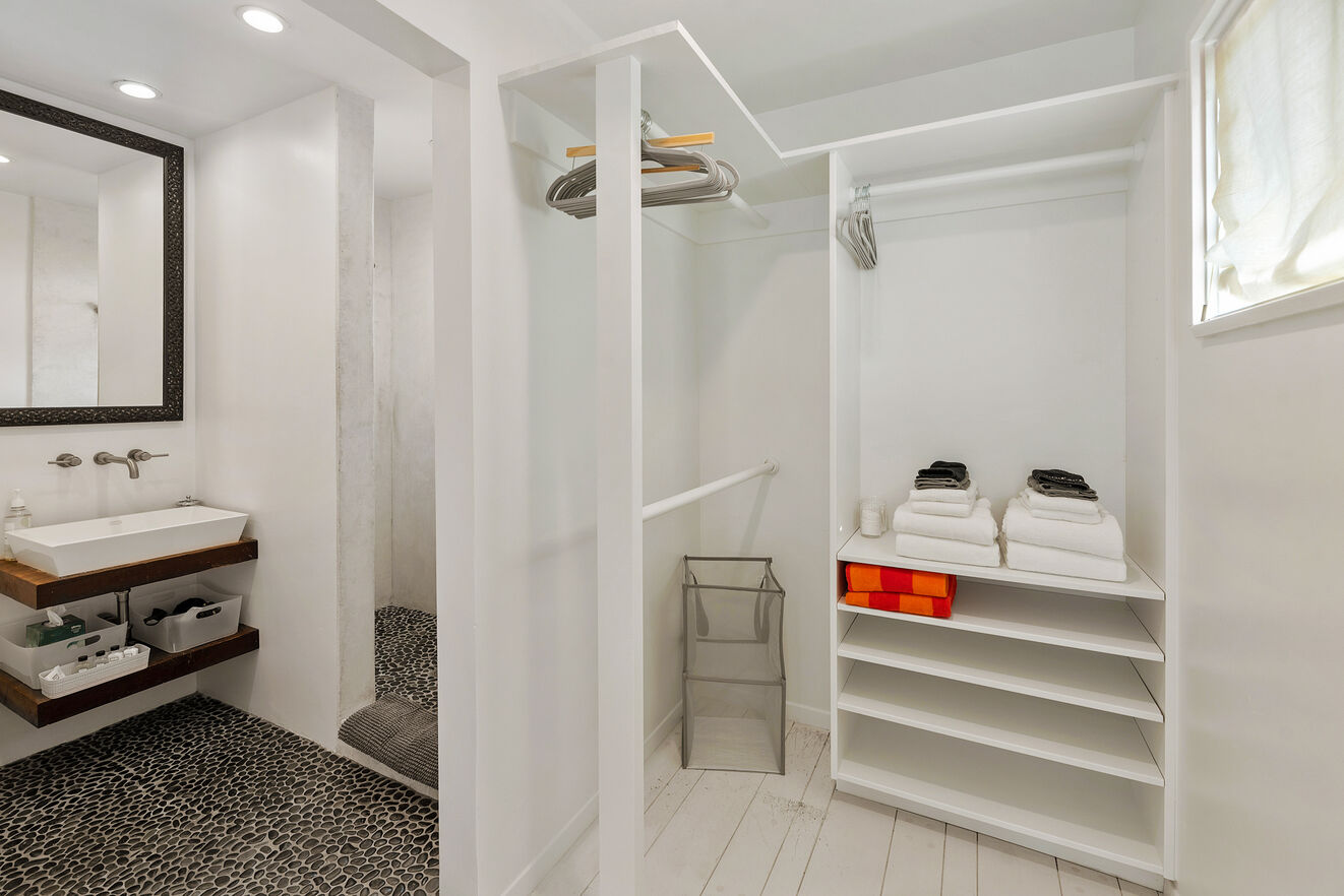 Walk in closet and ensuite bathroom to Master with walk in shower