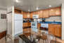 Fully Equipped Kitchen with Frigidaire appliances, ample counter-space, and comfortable dining area with seating for 6