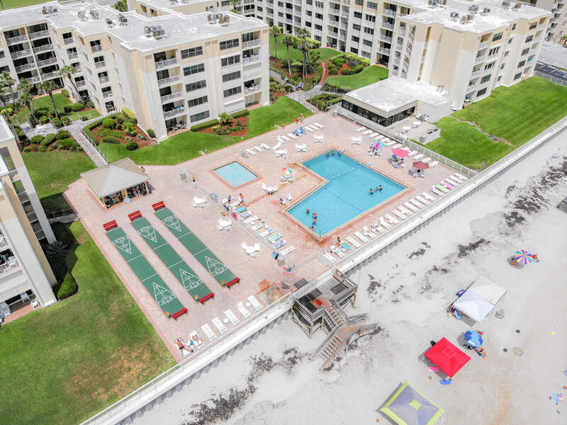Community pool and relaxation area taken from above
