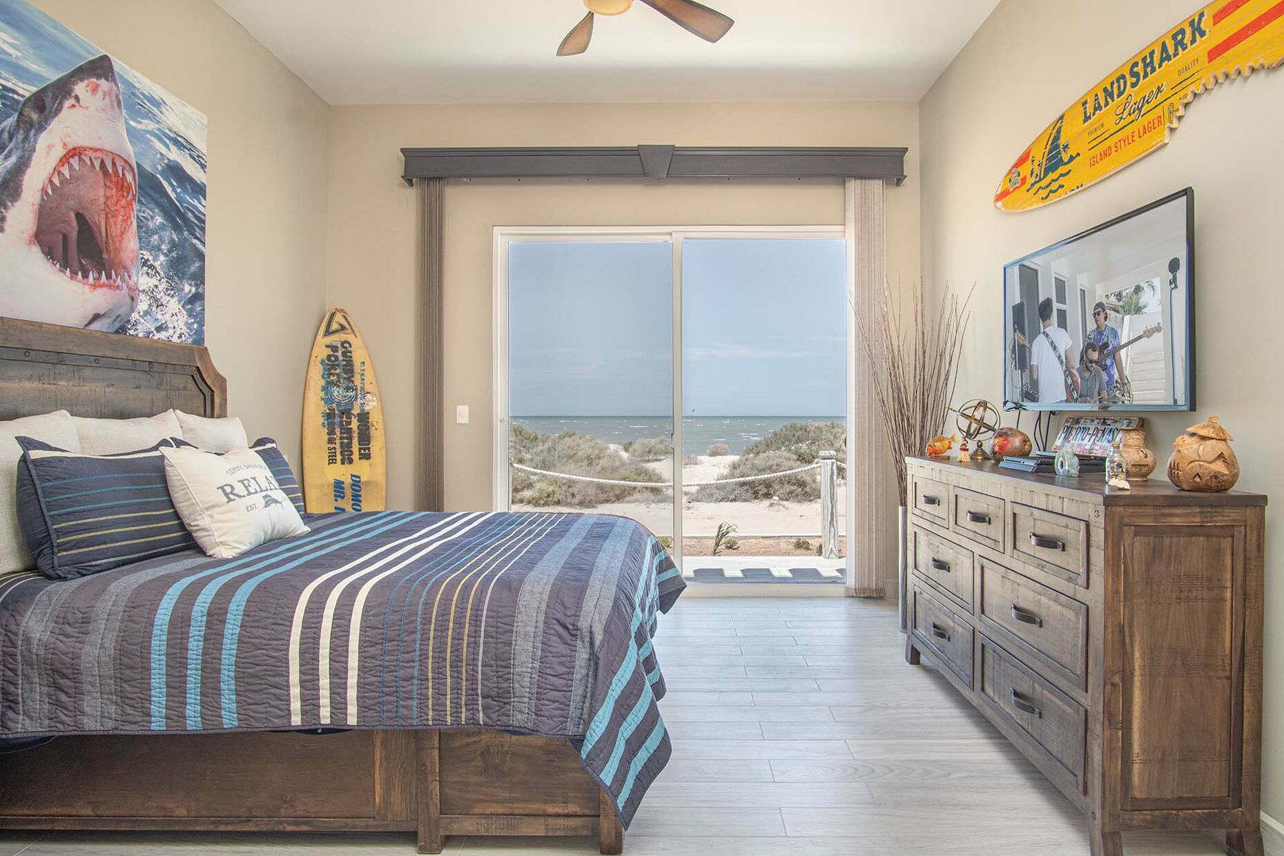A guest bedroom shows its beach character.