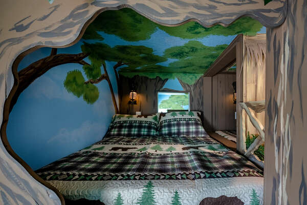 Rest is definitely exciting in this forest themed bedroom