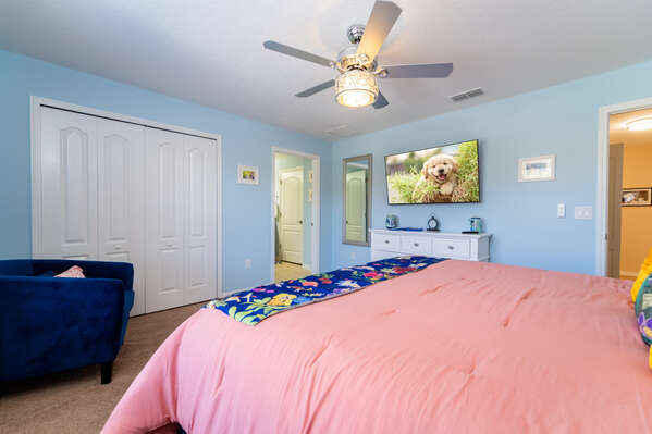 Master bedroom showing en-suite bathroom, closet and wall mounted flatscreen TV