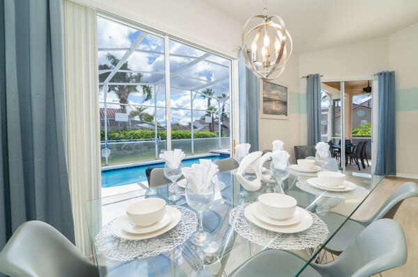 modern dining table with seating for 6 overlooking private pool (newly furnished 2021)