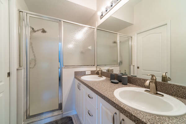 Master bath with dual sinks and walk-in shower