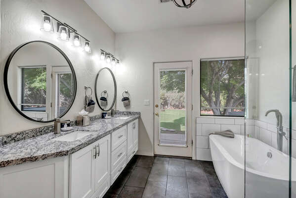 En Suite Master Bath with Dual Sinks, a Soaking Tub and Shower