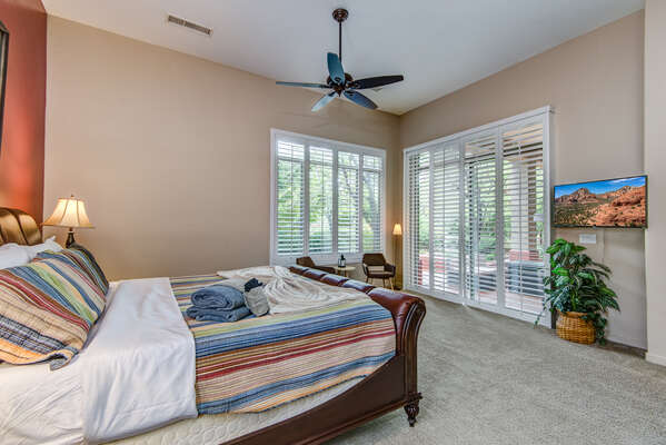 Master Bedroom with a Smart TV and Patio Access